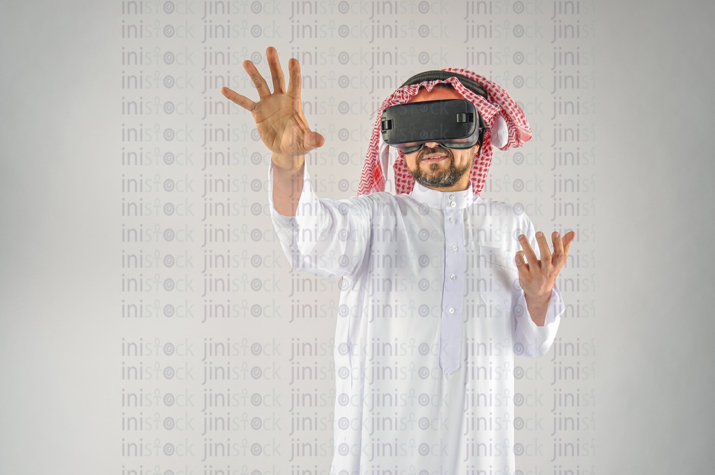 Khaliji man Saudi Arabian or Emirati or A man from the Gulf wearing VR glasses