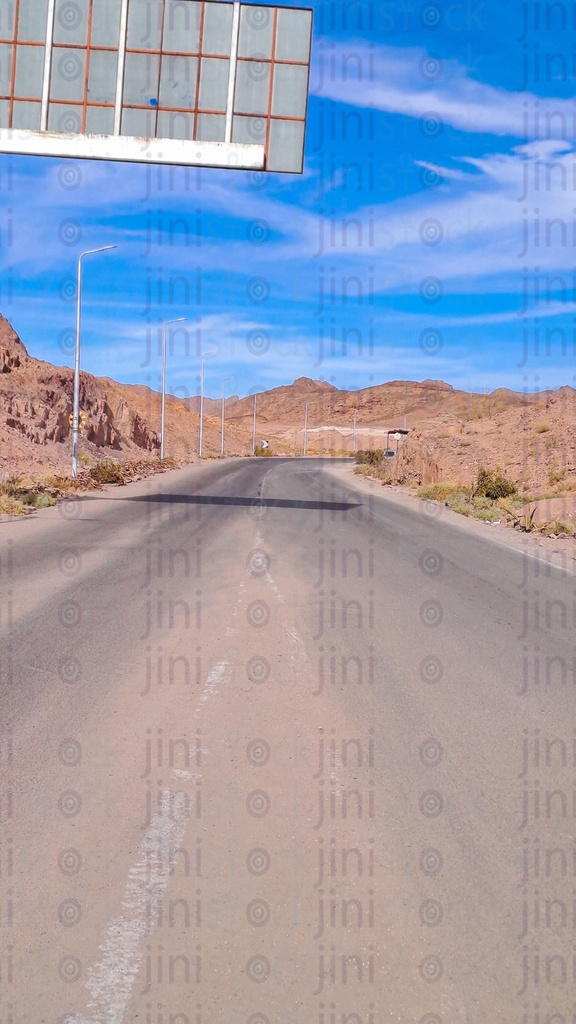 an empty Road with no cars or buses surrounded by Sinai mountains in South Sinai in Egypt