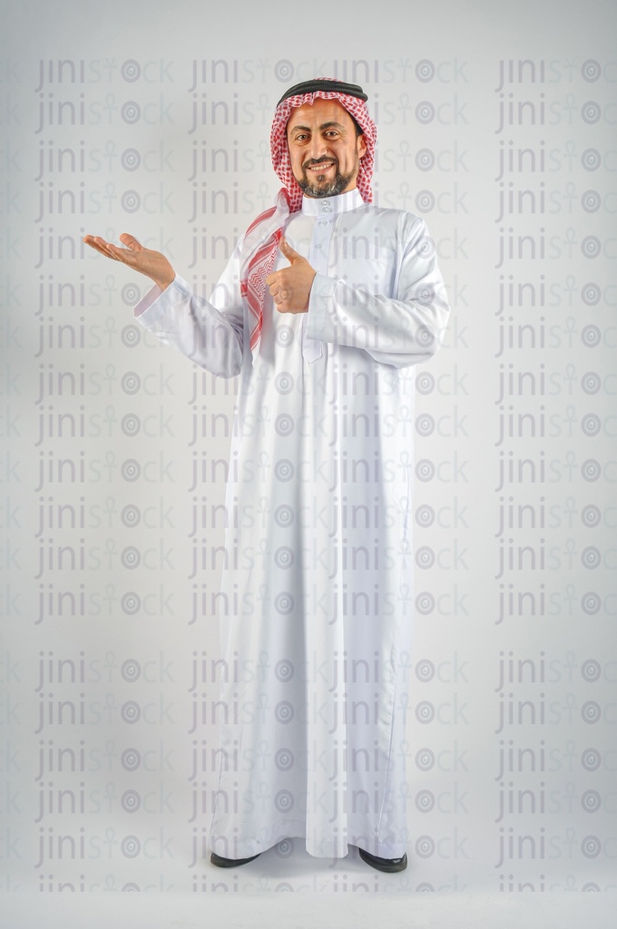 excited Khaliji or a Saudi Arabian man or a man from the Gulf raising the palm of his hand for putting a product on and showing thumb up.