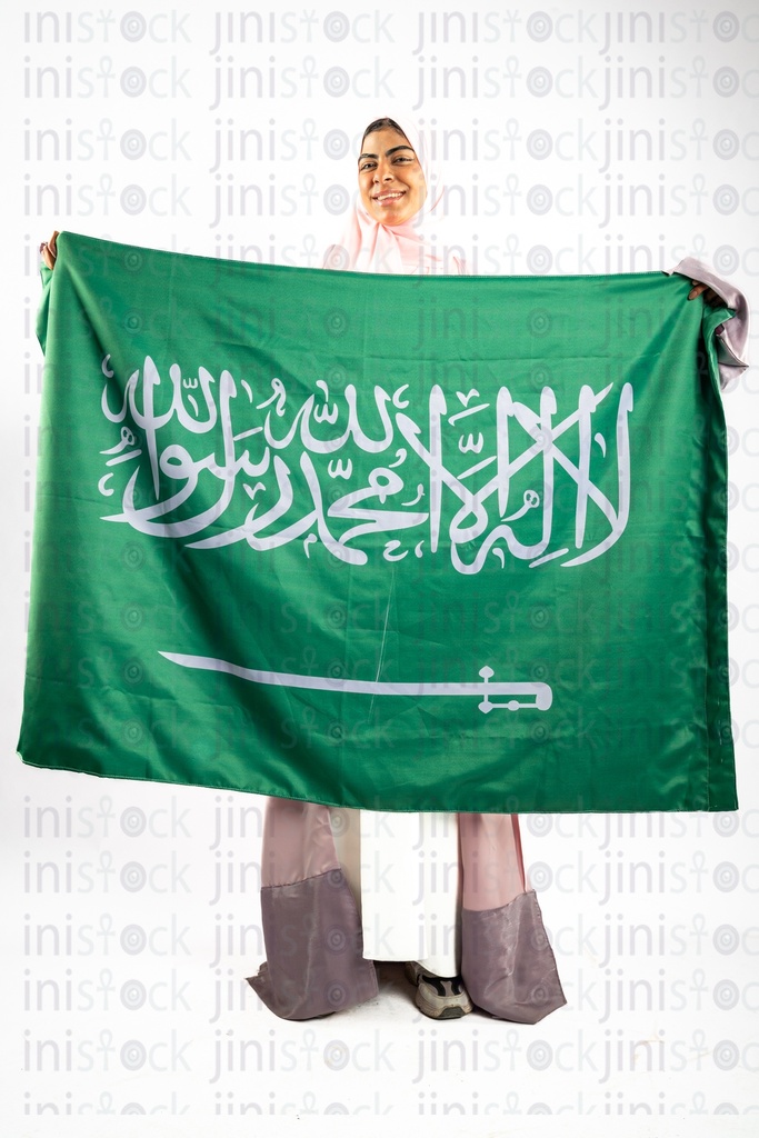 Khaliji woman from gulf saudi holding saudi flag