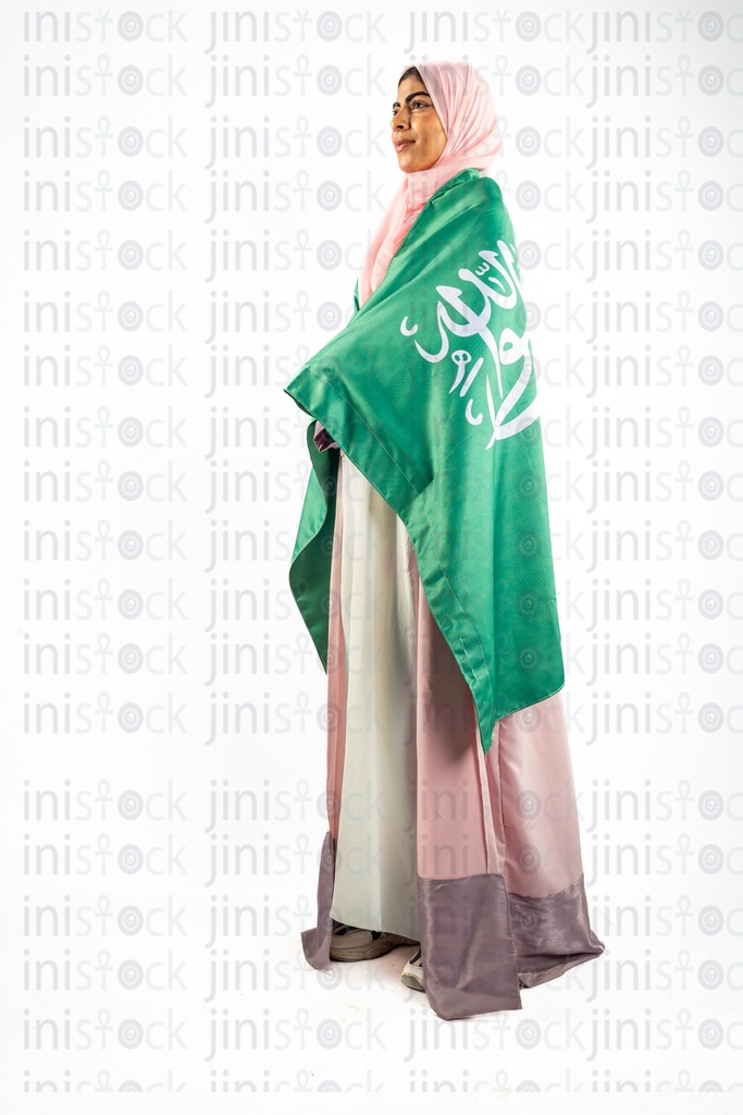 khaliji arab saudi woman from gulf carrying KSA flag