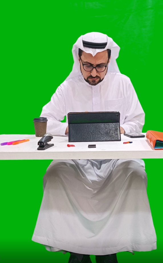 khaliji saudi arab from gulf working  on ipad or laptop