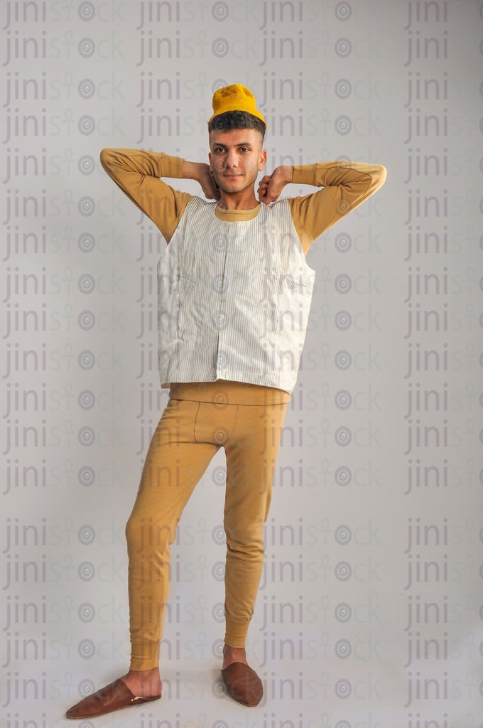 A farmer from the Egyptian countryside awoke. The farmer wearing the rural clothes.