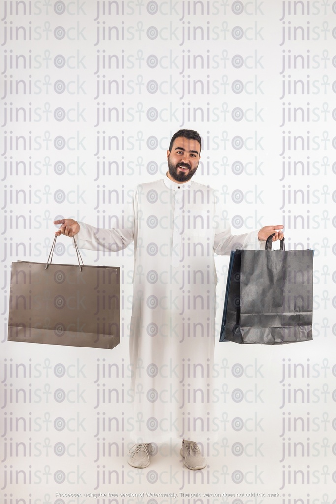 a stock image of a shopping khaliji Saudi man from gulf with bags on isolated background