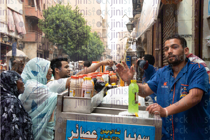 man on ramadan drink car - stock image