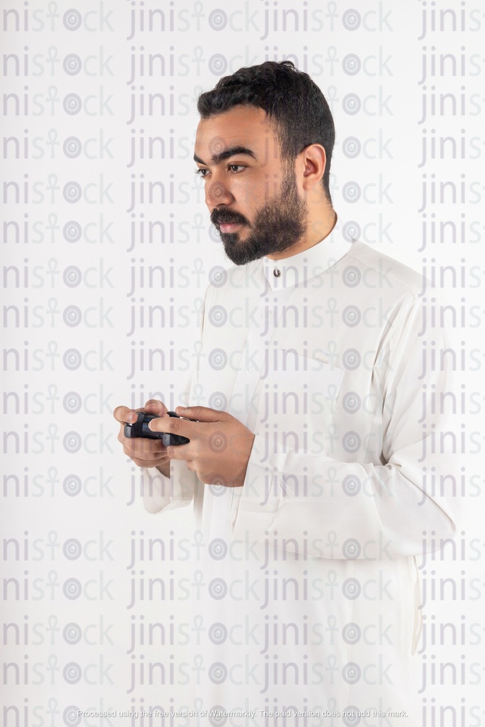 a stock image of a khaliji saudi gulf man with a play station joystick