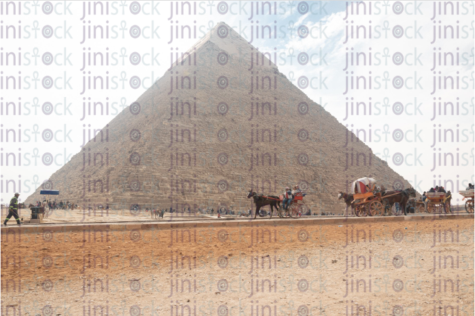 Pyramid close up - people riding horse carriages - stock image