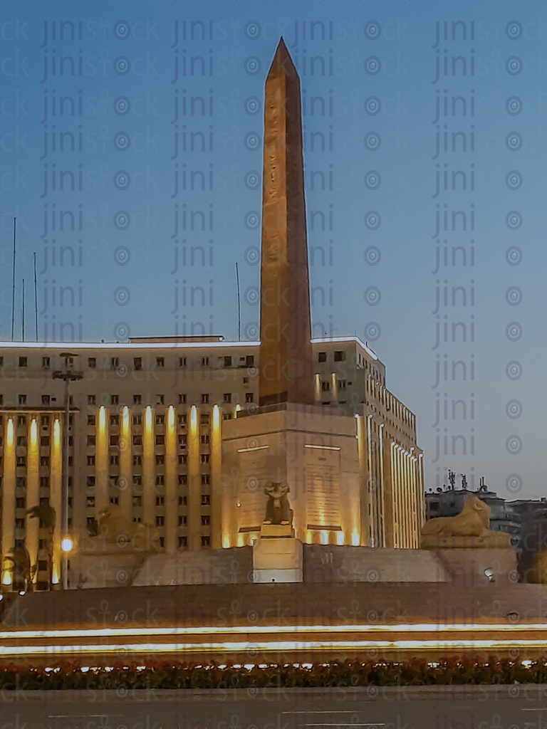 The obelisk,  The Rams,and Mogamaa Al- Tahrir,in Tahrir Square, Cairo, Egypt at night, and the Street were empty of cars, use as a background for designs on Cairo streets.