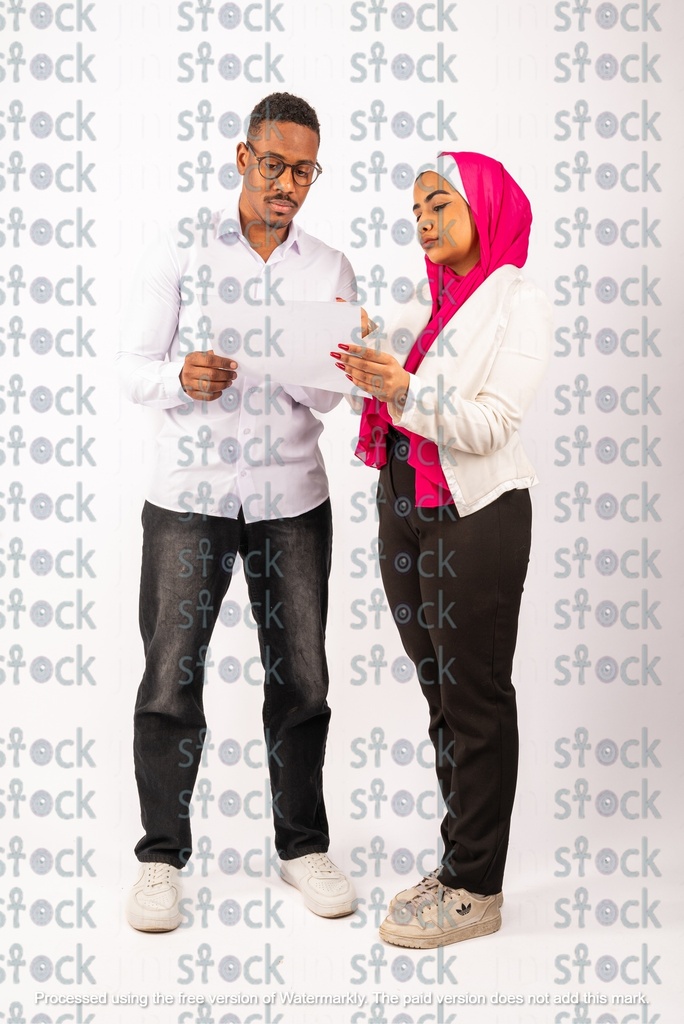A veiled Nubian girl talking to a Nubian young man holding a paper