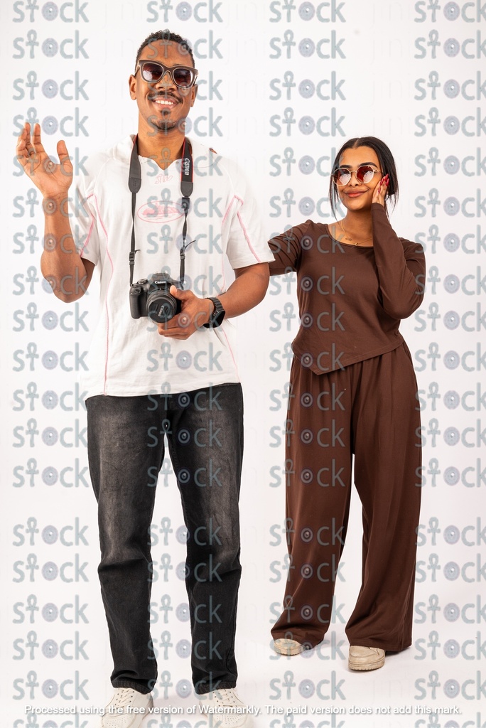 A Nubian girl and a young man, and the young man has a camera in his possession