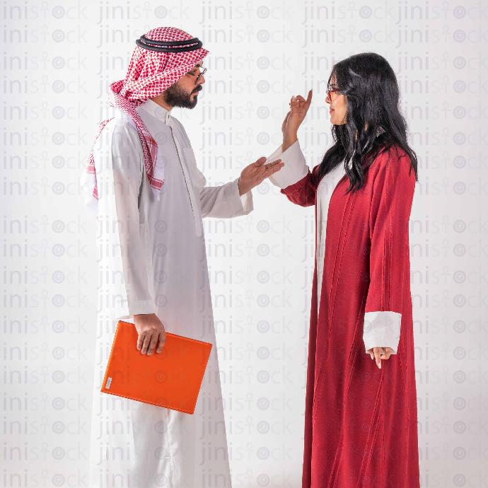 khaliji man and woman talking stock image