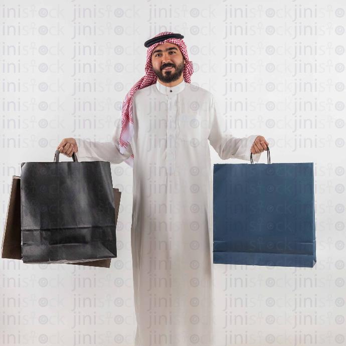 khaliji man shopping bags stock image