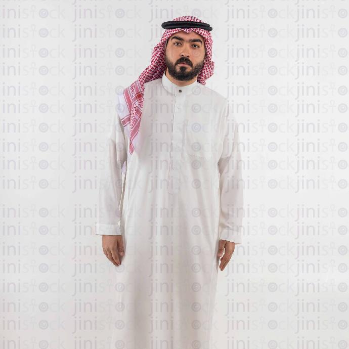 khaliji man standing with hands next to him stock image with high quality