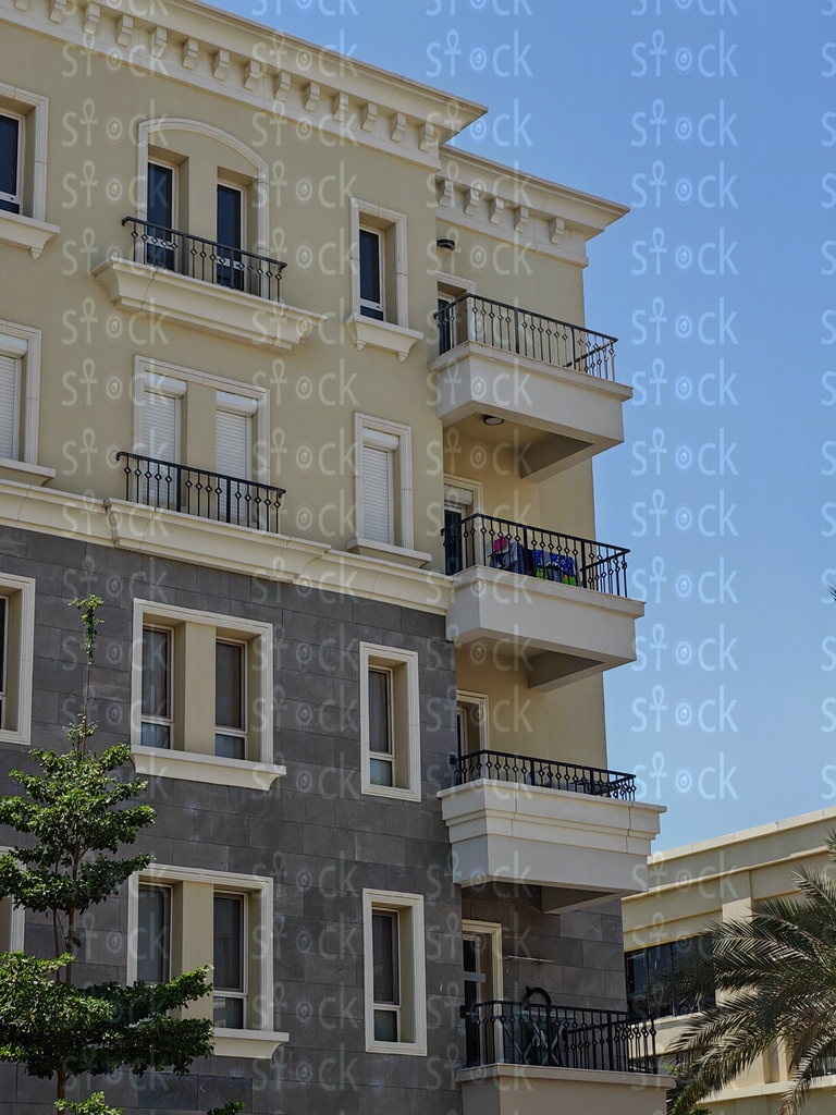 Beige residential block with balconies 