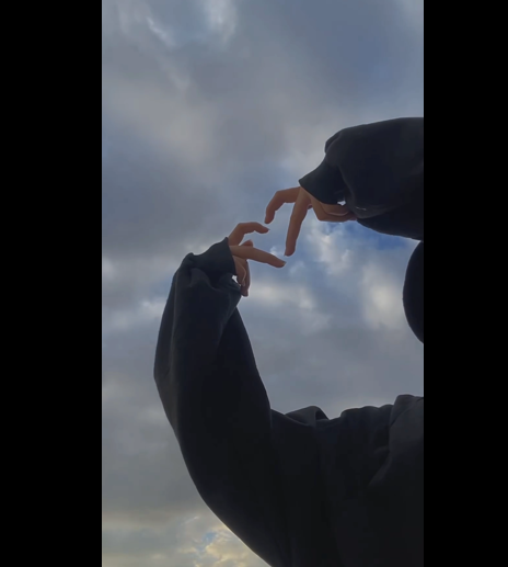 girl making heart shape