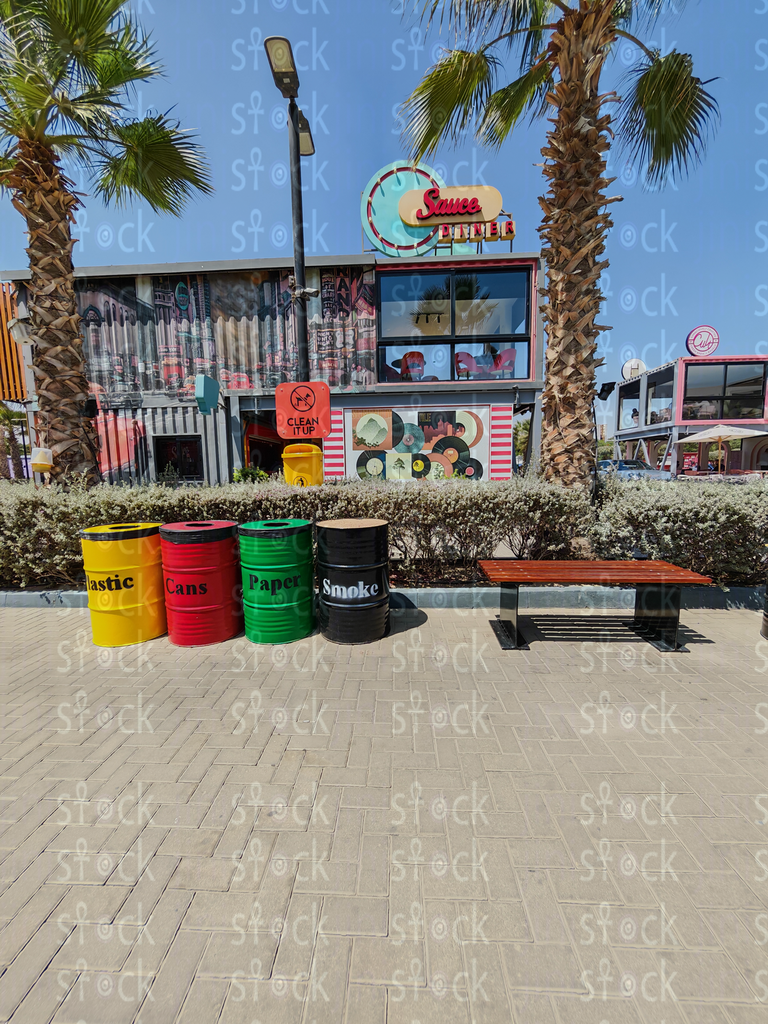 Walkway with trash bins