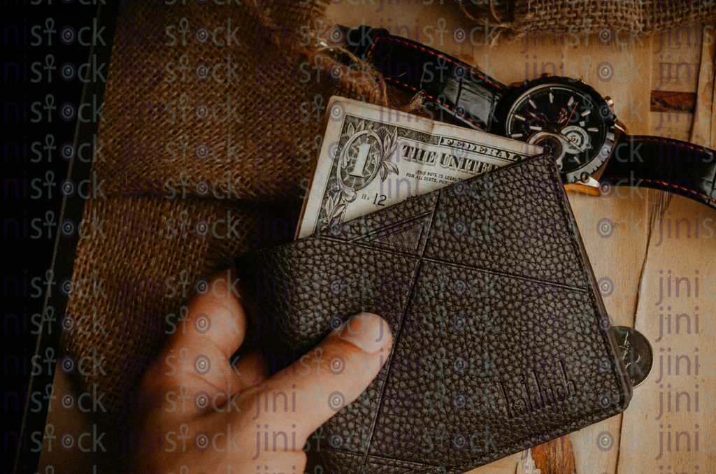 hand holding a wallet- Stock image