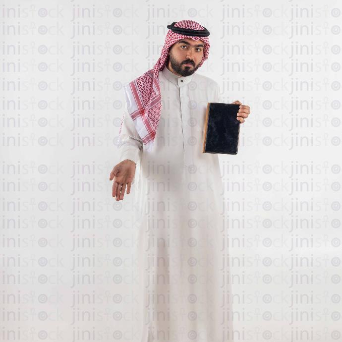 khaliji man with tablet stock image with high quality