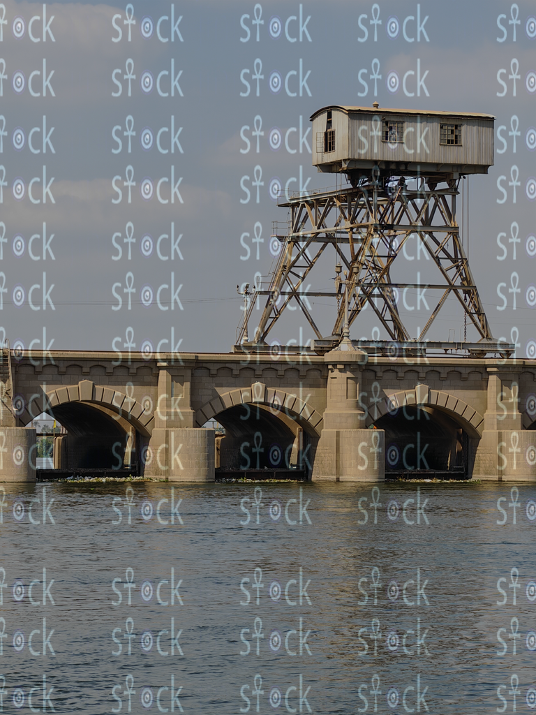 Bridge Shadows Over Flowing Water 