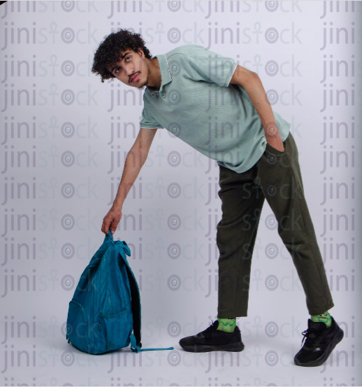 young man carrying his backbag - stock image