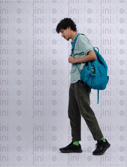 young man walking in isolated background - stock image