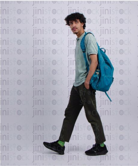 young man walking with back bag - stock image