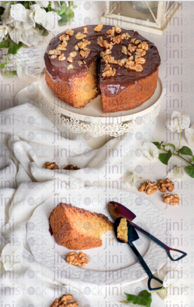 chocolate cake on a glass plate - stock image