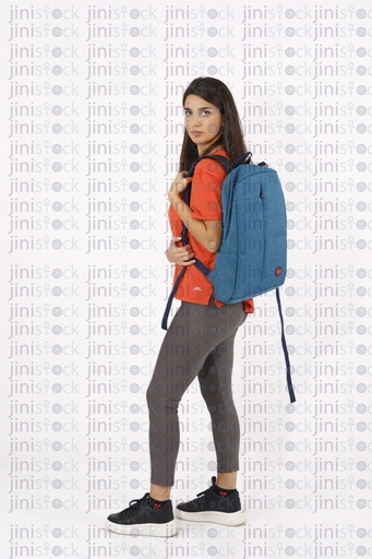 A female model is working out and wearing a backbag on isolated background