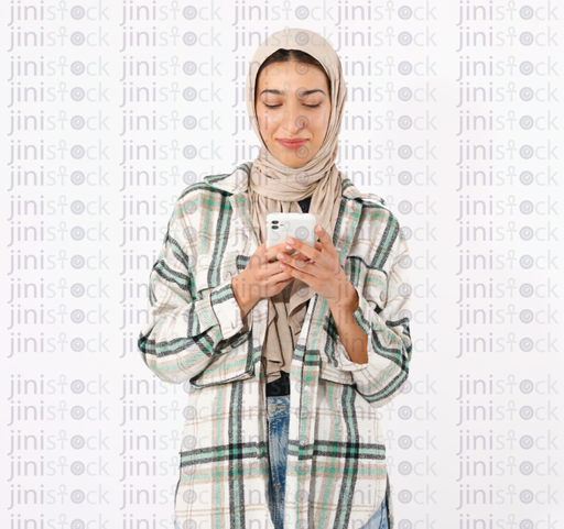 Young attractive hijabi woman millennial with phone in hands spends all free time on smartphone suffering