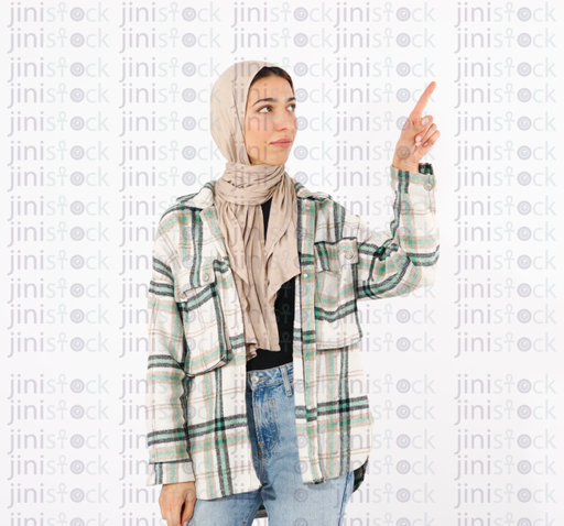 a girl wearing hijab is pointing at something