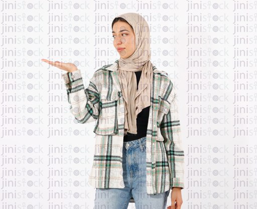 hijabi girl looking at something at her hands