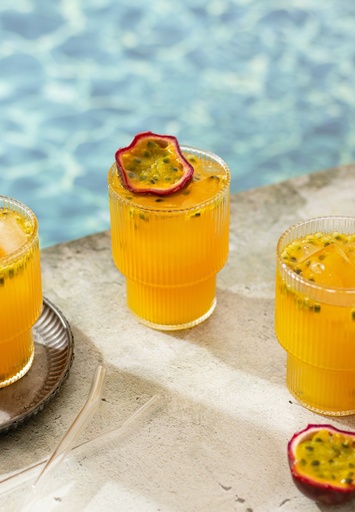 Orange juice at the pool - stock image