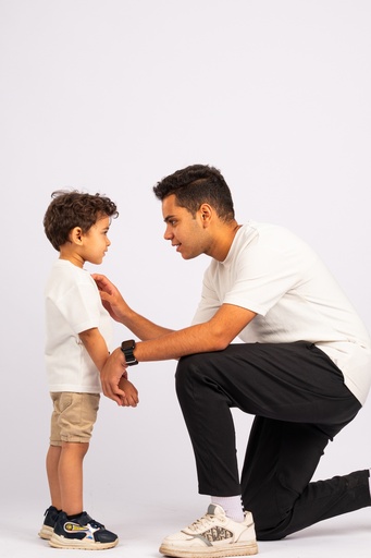 a father talking to his boy - stock image