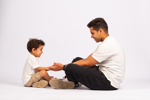 father son playing with each other - stock image