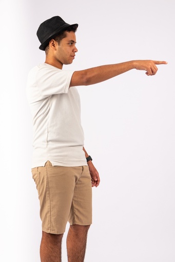 young egyptian man in summer wear pointing at something - stock image