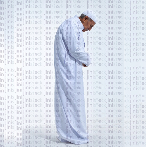 old man in white galabia praying side view