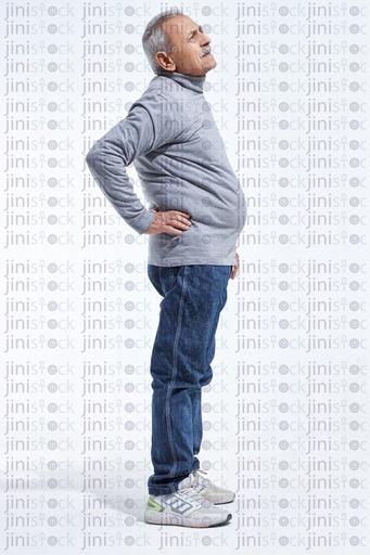 Old man with lower back pain full length side view