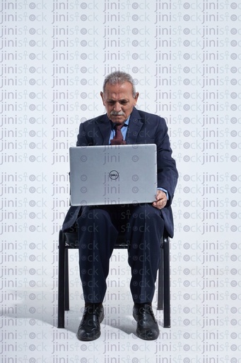 old man working on the laptop sitting down