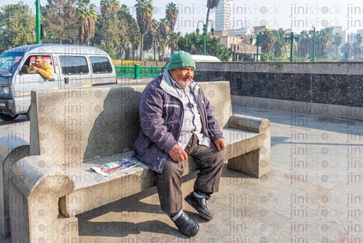 old man sitting on a bench