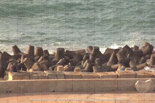 Sea fenders Alexandria Egypt sea waves crashing over rocks