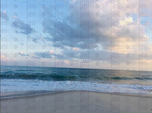 waves on the beach during summertime sunset over the sea