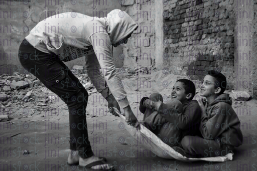 boys playing in rural area - stock image