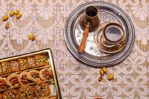 Turkish coffee next to oriental dessert