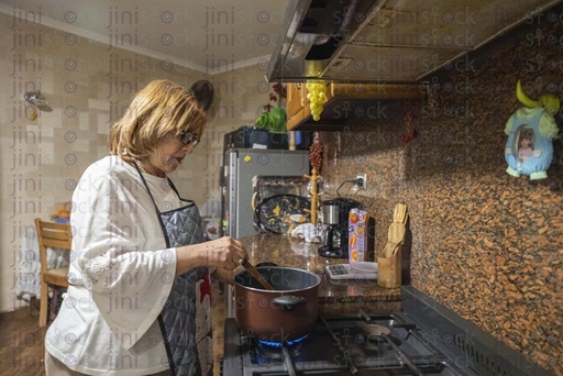 old woman cooking in the kitchen