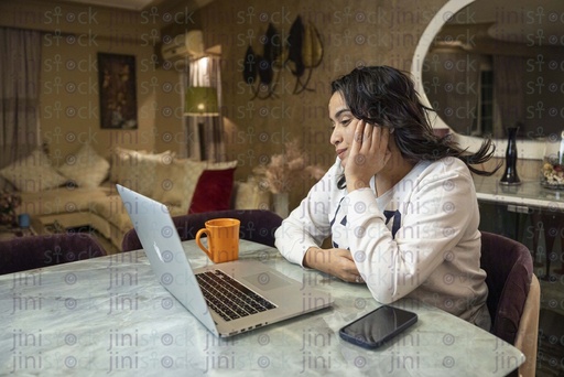 woman watching her episode on the laptop