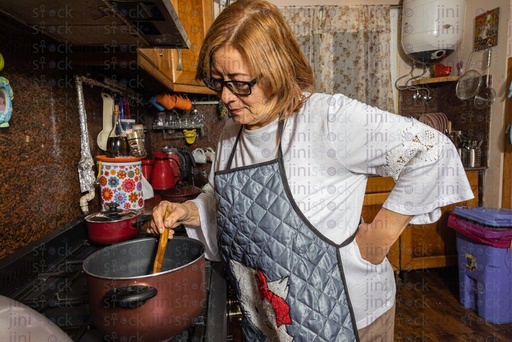 grand mother cooking on the kitchen stow