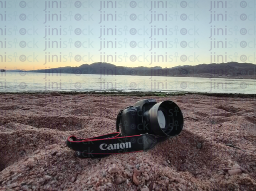 camera canon on the sandy beach