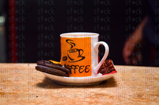 mug of Coffee with Oreo on the side - stock image