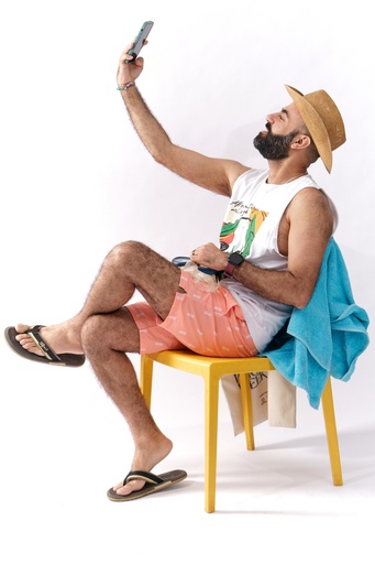 man taking a selfie on the beach.