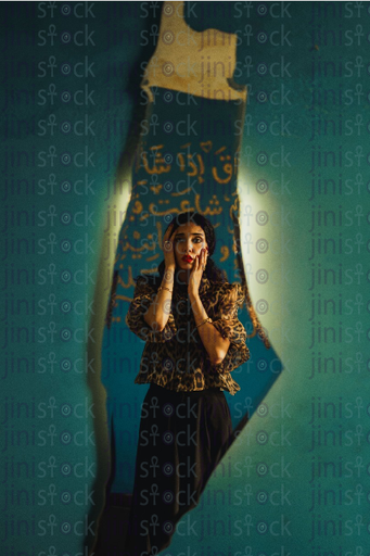 a woman relfection on a palestine shaped mirror -stock image